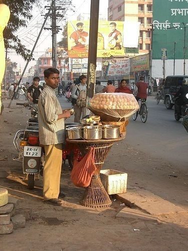 A chai vendor with his cart on a city street